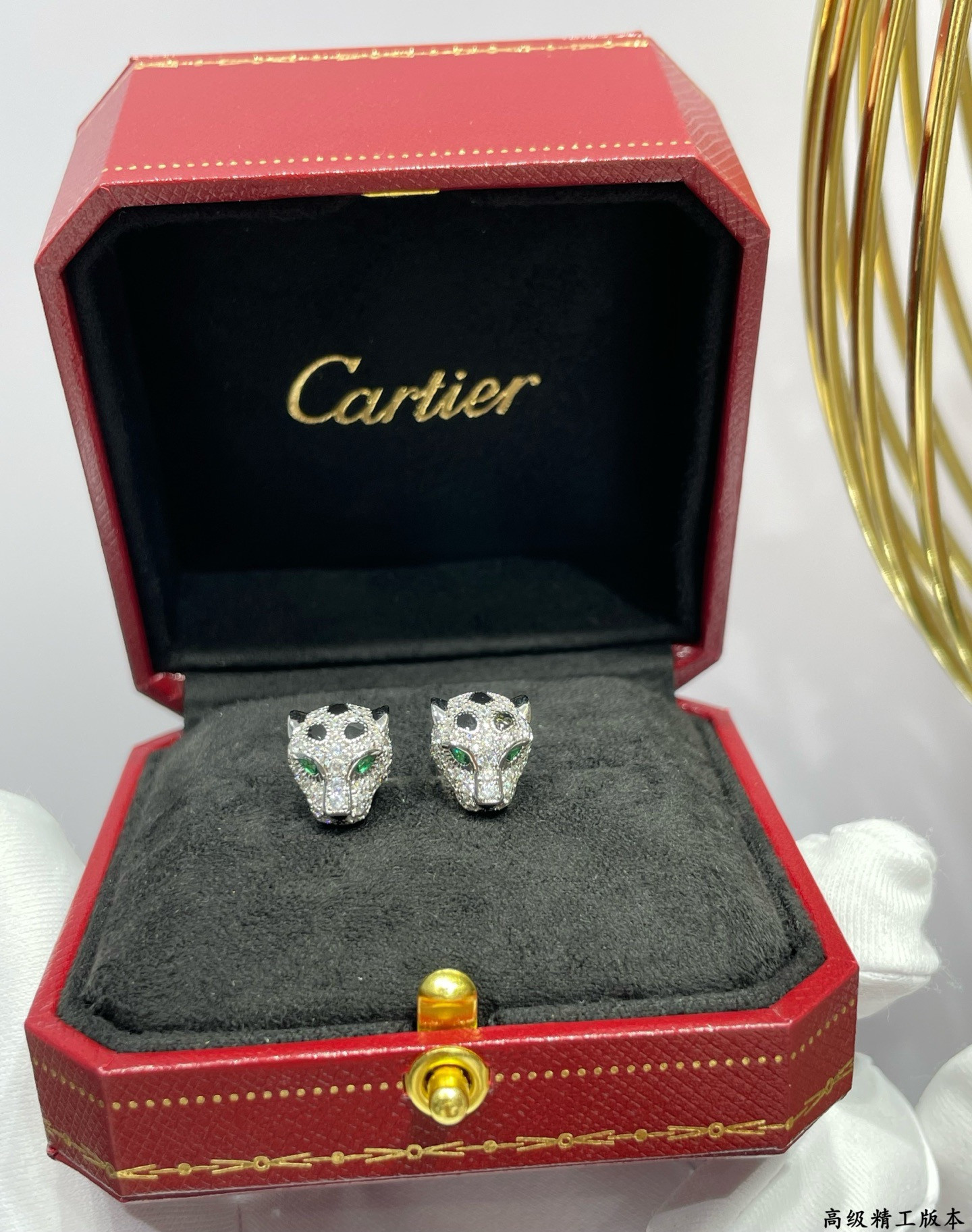 Ca*t*er earrings