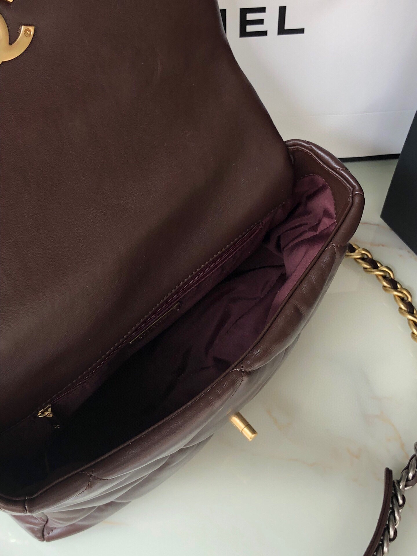 Ch*el 19 large handbag shiny leather, gold-tone, silver-tone & ruthenium-finish metal brown 7.8 × 11.7 × 3.9 in